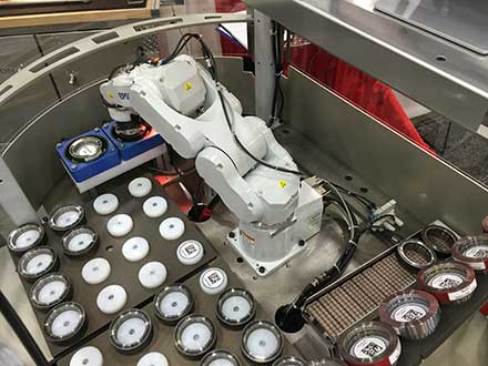 Robotic work cell sorting gears for proper heat treat